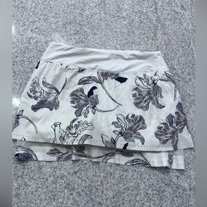 Athleta Laser Run Skort in a white, black, gray & mint floral nouveau print